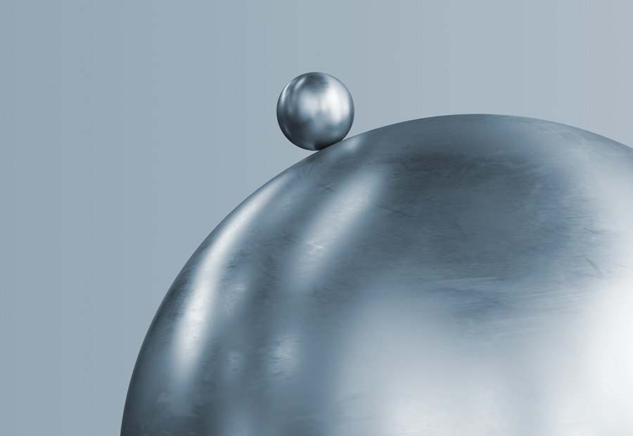Two polished steel spheres, one small and one large