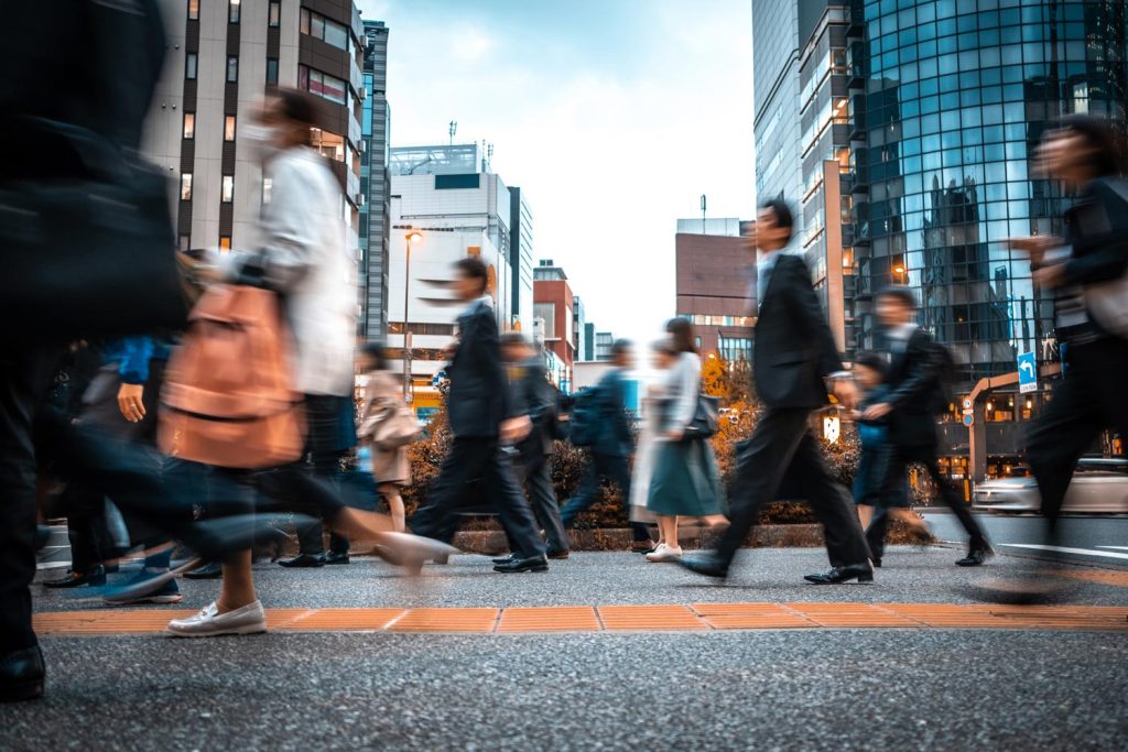 Business people walking through city street