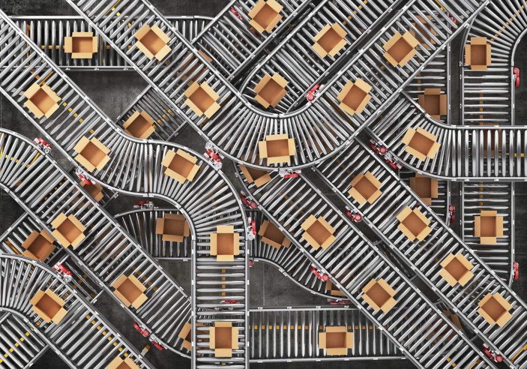 Cardboard boxes being transported along automated conveyer belts