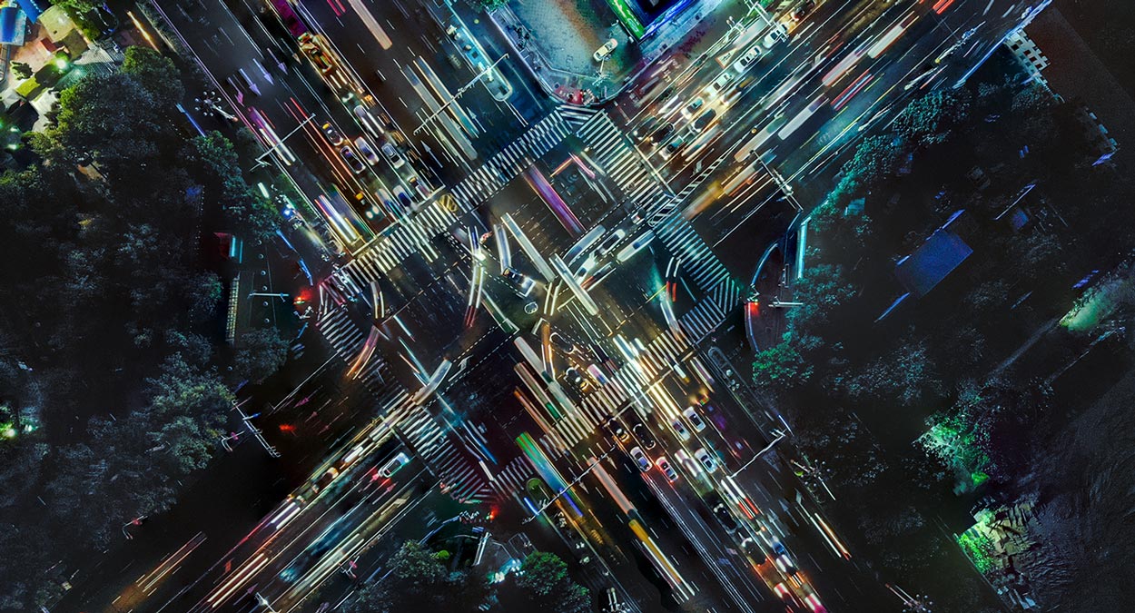 Birds-eye view of a busy intersection at night