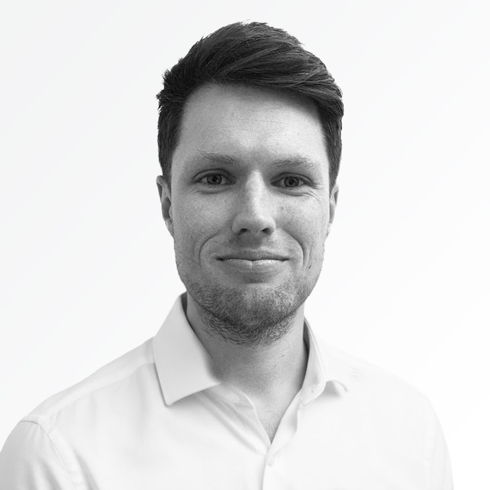 Black & white portrait photo of Charlie Jackson, Hammerforce Chief Commercial Officer